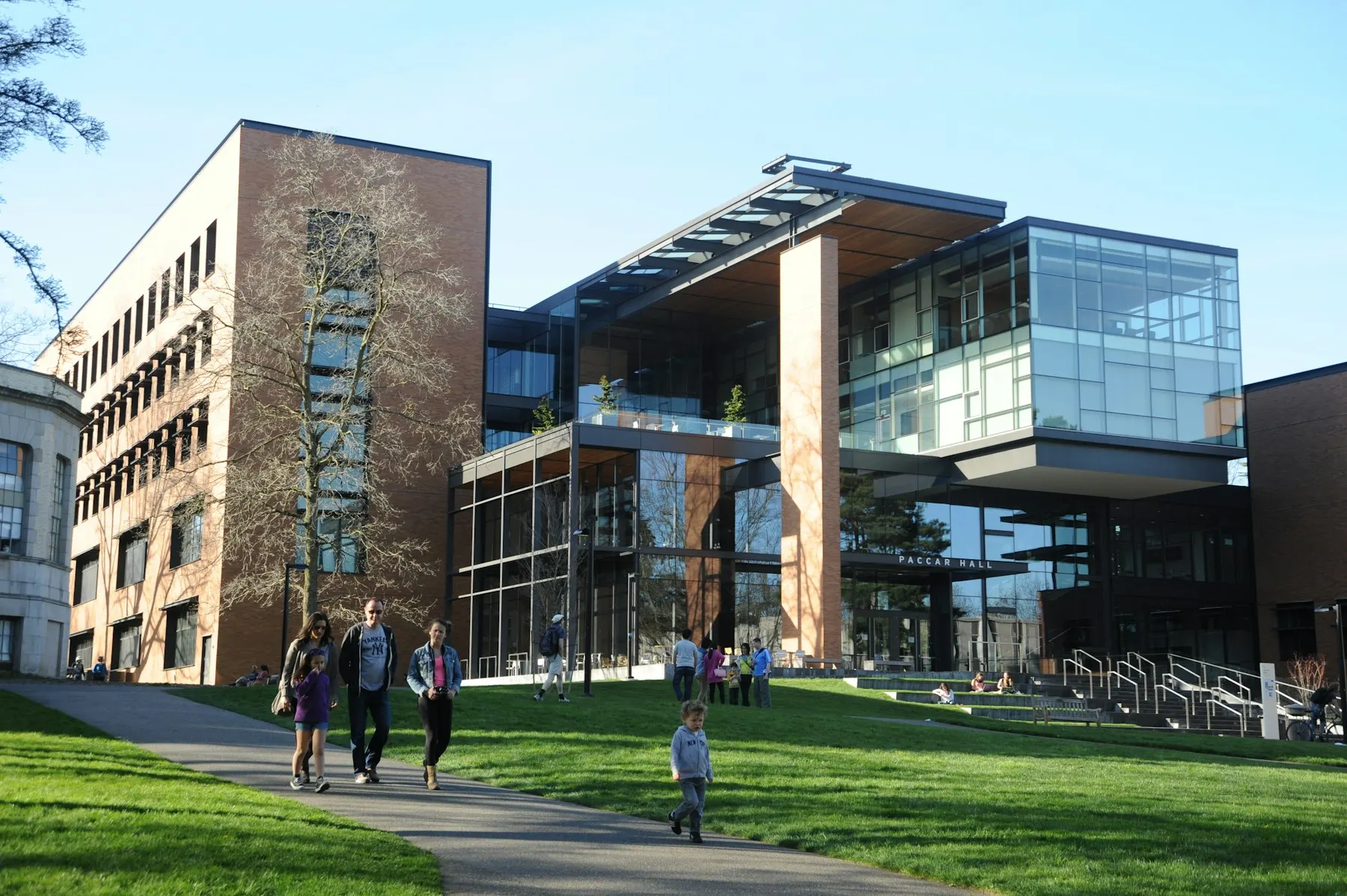 Students walking outside a modern university building